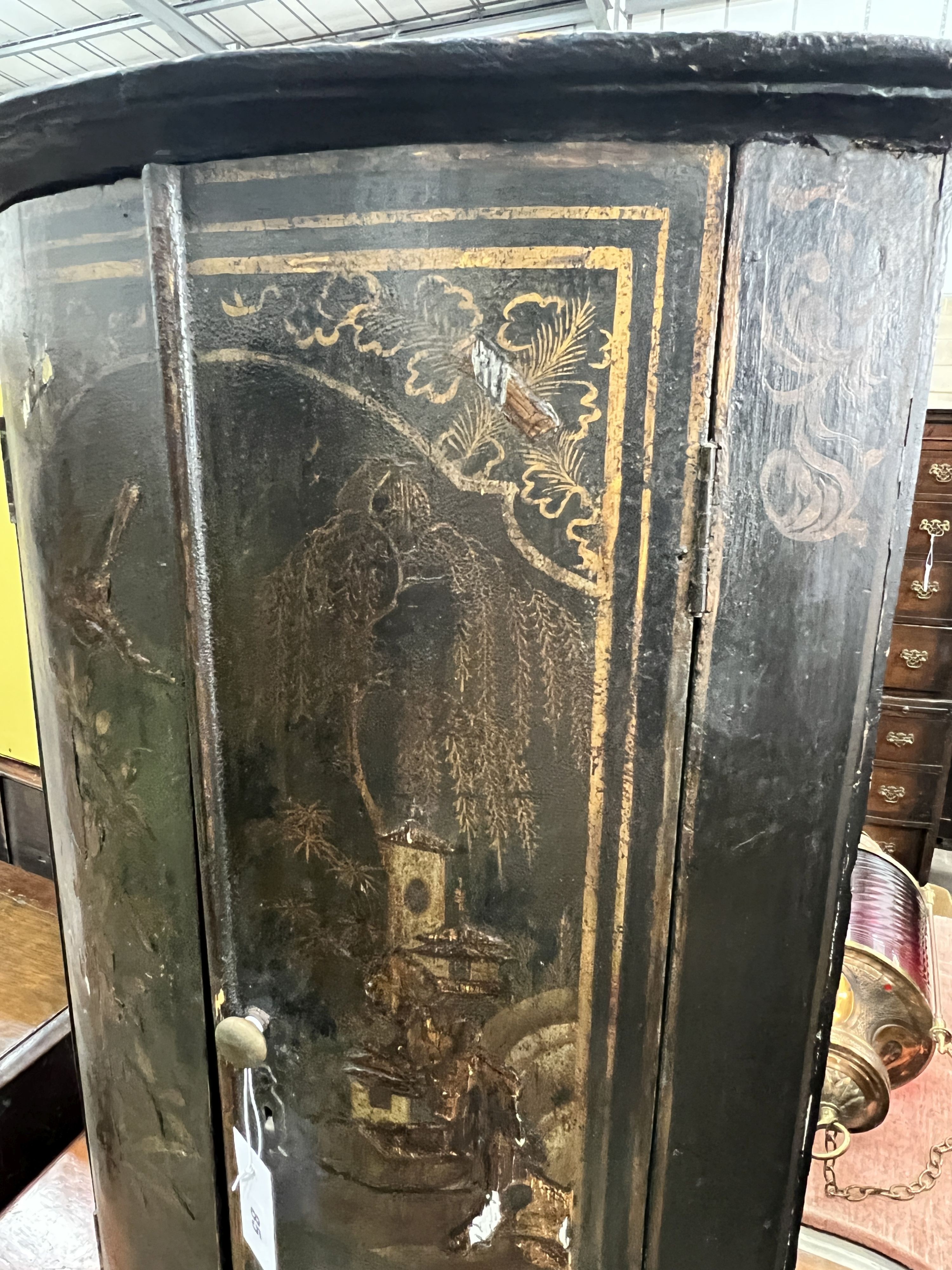 A 19th century chinoiserie lacquer bowfront hanging corner cabinet, width 56cm, depth 34cm, height 91cm